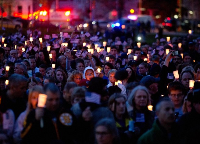 Mourners attend candlelight vigil for Martin Richard at Garvey Park, near Richard's home in the Dorchester section of Boston, on Tuesday, April 16, 2013. Martin is the 8-year-old boy killed in the Boston Marathon bombing. (AP Photo/The New York Times, Josh Haner)
